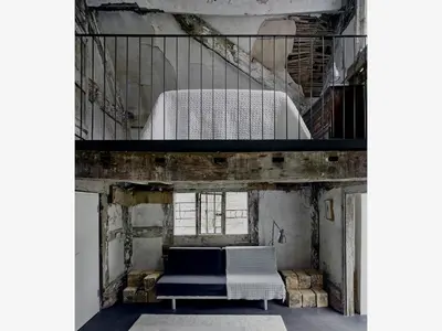 a room with a bed and a staircase at Croft Lodge Studio in Leominster