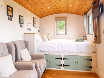 a small bedroom with a bed and a couch at Cheviot in Oswestry