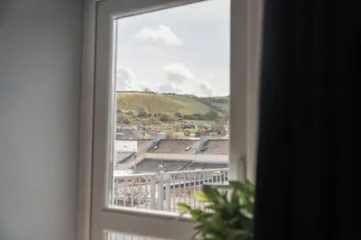 a window with a view of a city at Mermaids Hideaway in Aberaeron