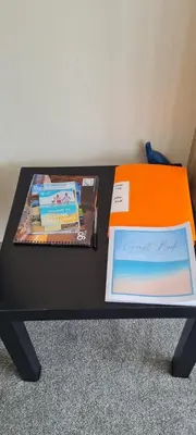 a black and orange table with books on it at Sher, My Happy super static -2026 Award winner in Llanddwywe