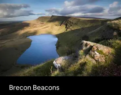 a lake on a hill with the words dragon beacons at Kookaburra Cottage in Brecon