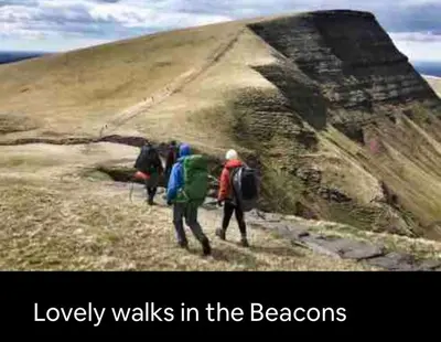 a group of people walking up a mountain at Kookaburra Cottage in Brecon