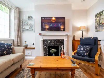 a living room with a tv and a fireplace at Fantastic 3-bed home close to Shrewsbury centre - Pass the Keys in Shrewsbury