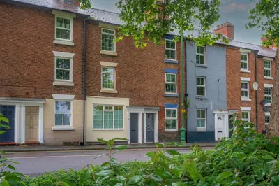 a row of brick houses on a street at Fantastic 3-bed home close to Shrewsbury centre - Pass the Keys in Shrewsbury
