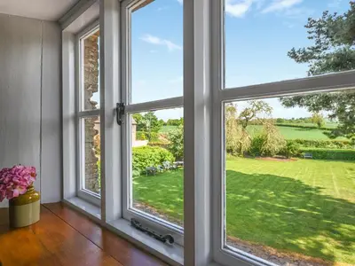 an open window with a view of a yard at Ford Farm in Ludlow