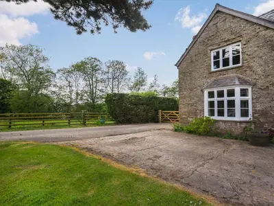 an external view of a brick house at Ford Farm in Ludlow