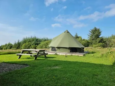 a tent and a picnic table in a field at Glamping Pod - Sleeps 2 - Pets - Parking - Wifi in Llanon