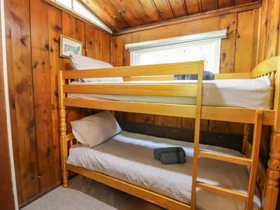a bunk bed room with two bunk beds in a cabin at Ty Bedwen in Machynlleth