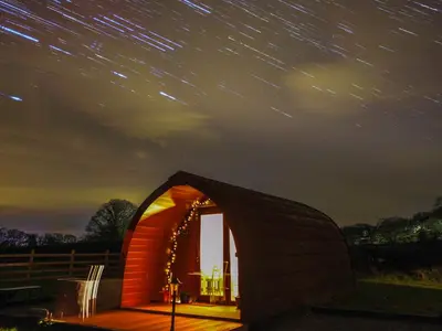 a small dome tent under a starry sky at night at Ty Twt Teifi in Tregaron