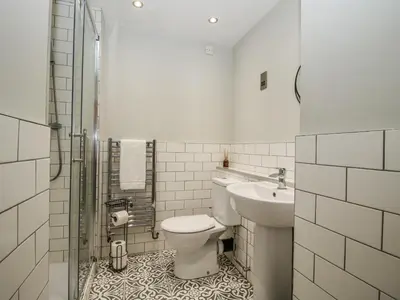 a bathroom with a toilet and a sink at 1C College Hill in Shrewsbury