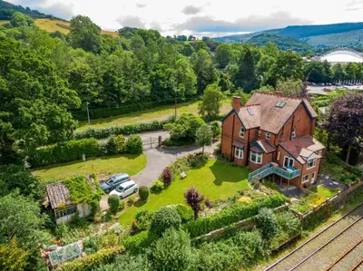 an aerial view of a house with a yard at Outstanding Llangollen Riverside Apartment in Llangollen