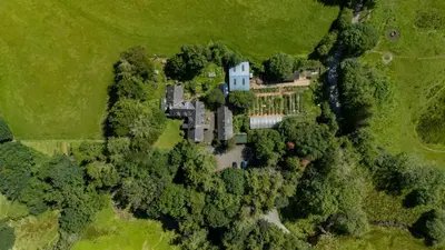 an aerial view of a mansion in a field at Ty Neuadd in Dolgellau