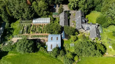 an aerial view of a house on a hill at Ty Neuadd in Dolgellau