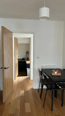a dining room with a table and a kitchen at Builth wells stay in Builth Wells