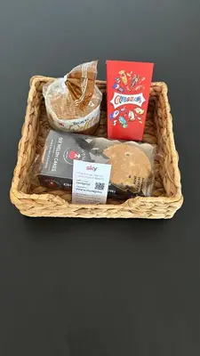 a basket filled with different types of food on a table at Builth wells stay in Builth Wells