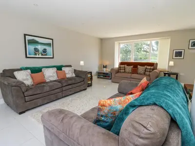 a living room with two couches and a couch at Little Penrhosgoch Barn in Llandrindod Wells
