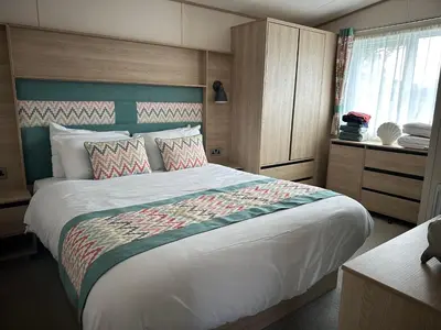 a bedroom with a large bed in a room at 186 Barmouth Bay Holiday Park in Barmouth
