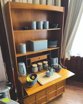 a wooden shelf with bowls and dishes on it at Bala Suite at pen Y Coed Hall in Dolgellau