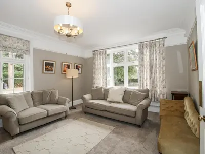 a living room with two couches and a couch at The Old Vicarage in Leominster