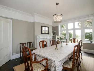 a dining room with a table and chairs at The Old Vicarage in Leominster