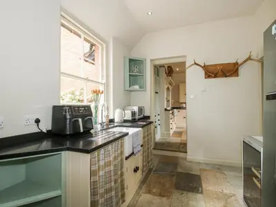 a kitchen with a sink and a counter top at The Old Vicarage in Leominster