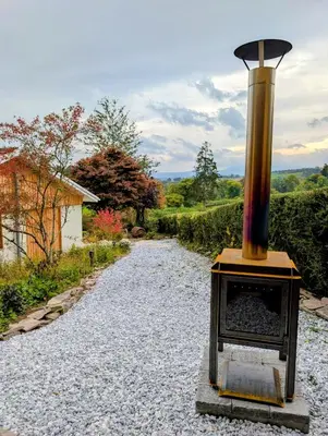 a stone road with a stove in the middle at Modern Bungalow Views of Pen y Fan in Brecon