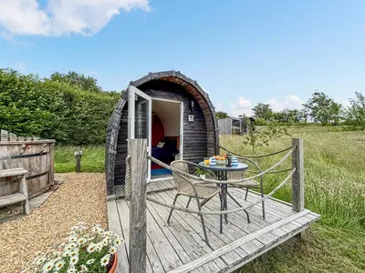 a playhouse with a table and chairs in it at The Sheep Pod - Uk50074 in Welshpool