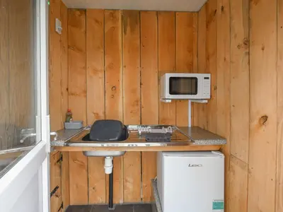 a kitchen with a counter with a microwave and a sink at The Sheep Pod - Uk50074 in Welshpool