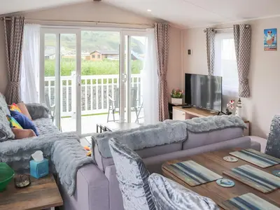 a living room with a couch and a table at The Laughing Seagull - Uk50213 in Aberystwyth