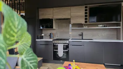 a kitchen with a stove and a sink at Daverneithon 3 in Rhayader