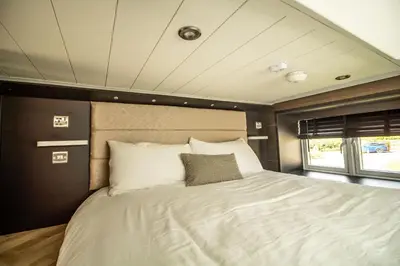 a bedroom with a bed in the middle of it at Daverneithon 4 in Rhayader