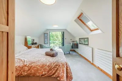 a bedroom with a bed and a window at 2 Bed in Llanybydder oc-b32255 in Cwrt-newydd