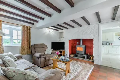 a living room with a couch and a fireplace at 2 Bed in Yatton oc-s32603