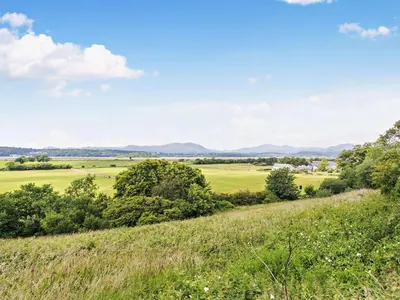 a view of a field from a hill at 4 Bed in Talsarnau oc-96164 in Talsarnau