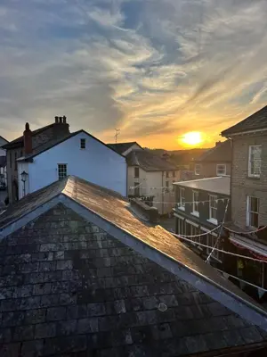 a view of the sunset from the roof of a house at Rooftops Loft in Hay-on-Wye