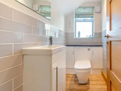 a bathroom with a sink and a toilet at Hafod Y Morfa - Uk48829 in Harlech