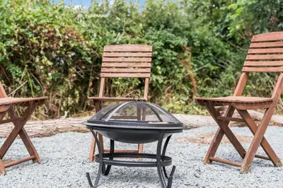 two chairs and a grill in between two chairs at Starry Nights Escape - Hot Tub & Sauna in Yarpole
