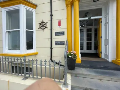 a person standing in front of a building at Cranwell Court in Aberystwyth