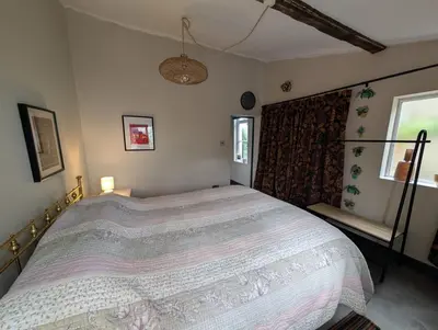 a bedroom with a large bed in a room at Grosvenor Studio Apartment in Llandrindod Wells