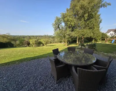 a table and chairs with a view of a field at Modern Retreat near Aberaeron - Luxe 1 bed Escape in Ciliau-Aeron