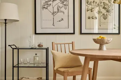 a dining room with a table and a table and chairs at Market View - The Georgian House in Ludlow