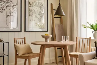 a table and chairs in a living room with a table at Market View - The Georgian House in Ludlow