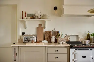 a kitchen with a sink and a stove top oven at Stretton Hills Peaks - The Georgian House in Ludlow