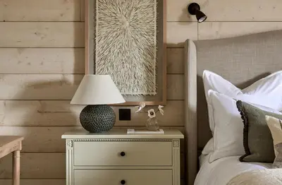 a bedroom with a bed with a lamp on a night stand at Stretton Hills Peaks - The Georgian House in Ludlow