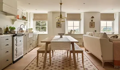 a kitchen with a table and a couch at Stretton Hills Peaks - The Georgian House in Ludlow