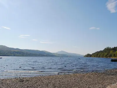 a lake with a bunch of birds in the water at Apartment Two - Uk49592 in Bala