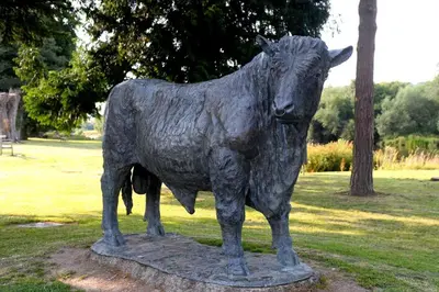 a statue of a cow standing in a park at 1 Bed in Garth oc-h32701 in Garth