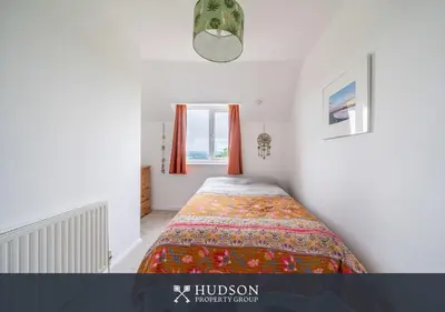 a bedroom with a bed in a room at Modern Snitton Cottage & Gardens in Ludlow