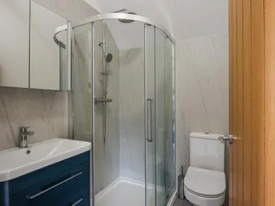 a bathroom with a shower with a toilet and a sink at Shropshire Way Stay in Farden