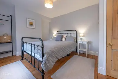 a bedroom with a bed in a room at Bodelen in Llanbedr